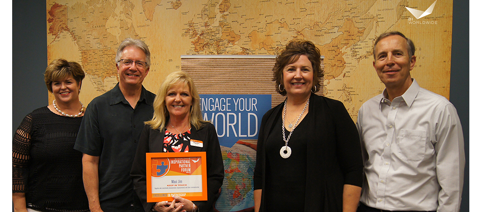 Award being presented to Karen Suttle for Maui Jim being recognized as Bi Worldwide Inspirational Partner